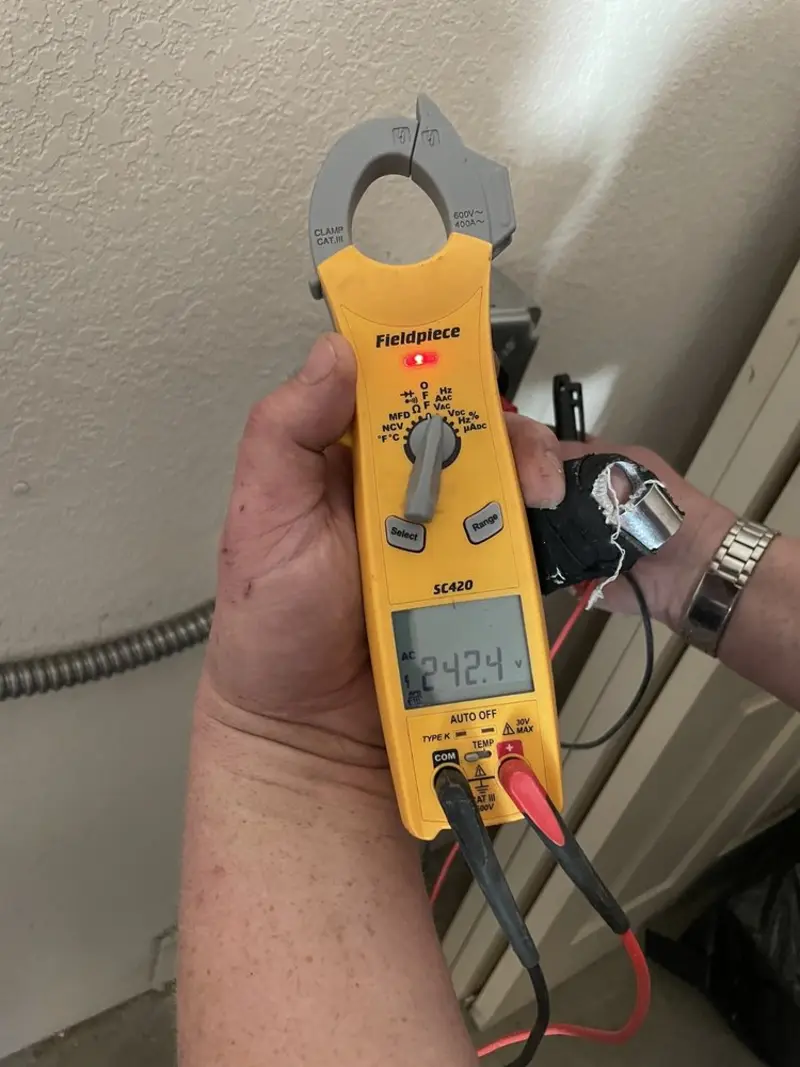 Voltage testing with clamp meter during Outlet Installation in Charleston